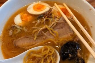 Traditional Hokkaido ramen with thick noodles and savory miso broth