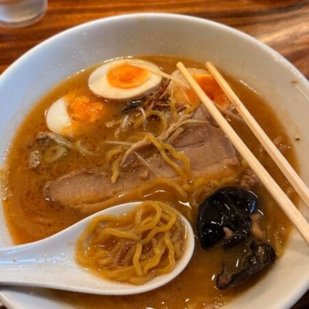 Traditional Hokkaido ramen with thick noodles and savory miso broth